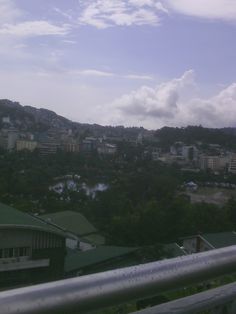 a view of a city from the top of a hill