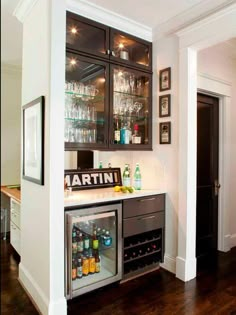 an image of a home bar with wine glasses on it