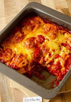 a square casserole dish with meat and cheese