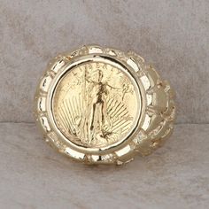 This men's 14k yellow gold ring has a nugget design with a 1/10oz $5 liberty coin in the center. The coin shows sign of wear but is still shiny and beautiful. The ring weighs 16.1 grams and the finger size 12.75. It measures 21 mm in height and 21.28 mm in length. Condition: Pre-Owned *All items are thoroughly inspected for quality assurance purposes 5 Dollar, Gold Nugget, Coin Ring, Yellow Gold Ring, Quality Assurance, Yellow Gold Rings, Rings Statement, Gold Ring, Statement Rings