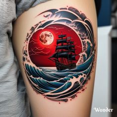 a woman's thigh with an image of a ship in the ocean on it