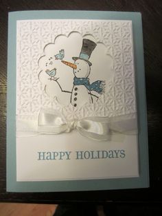 a happy holiday card with a snowman on it