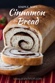 a loaf of cinnamon bread sitting on top of a cutting board