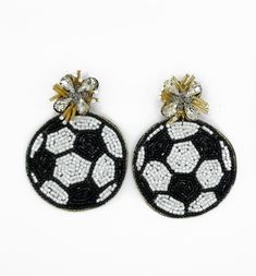 pair of black and white beaded earrings with soccer ball on the front, gold accents