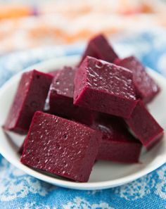 beets on a white plate sitting on a blue and white towel