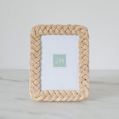 a frame with a monogram on it sitting on a table