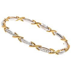 This brilliant line bracelet is crafted from 18K yellow and white gold. The alternating links of this bracelet display yellow gold crosses and white gold bars. The white gold bar links are set with brilliant cut diamonds creating a dazzling shine. The diamonds are approximately 0.32 TCW. Box style clasp with safety latch. Marks: 18K IRU Dimensions: 7 3/8" L x 1/4" W Weight: 18.8 Gross grams Luxury White Gold Bracelet With Intricate Design, Gents Bracelet, Diamond Bracelet Design, Modern Gold Jewelry, Gold Bars, Bracelet Tennis, 3d Printed Jewelry, Gold Link Bracelet, Bracelet Display