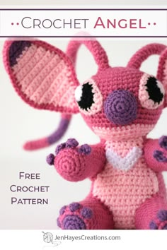 a crocheted pink and purple stuffed animal with black eyes, ears, and tail