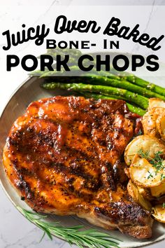 juicy oven baked pork chops on a plate with green beans and potatoes