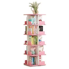 a pink book shelf filled with lots of books and flowers on top of each shelf