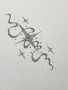 a black and white drawing of scissors with stars