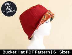 a white mannequin head wearing a red hat with floral print on it and the words bucket hat pattern 6 - sizes