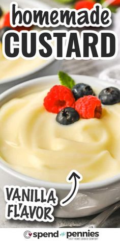 a close up of a bowl of pudding with berries on top and the words homemade custard above it