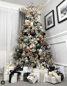 a decorated christmas tree with presents under it