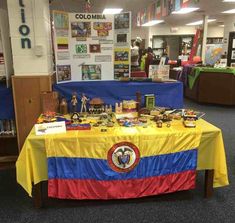 the table is covered with books and toys for children to play with in school library