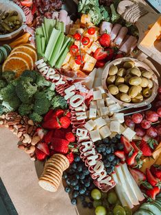 a table topped with lots of different types of fruits and veggies next to each other