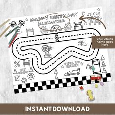 a printable race car birthday card with candy and candies on the table next to it