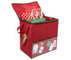 an open red storage bag with christmas items in the bottom and side pockets on top