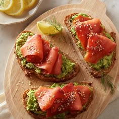 slices of bread topped with avocado and smoked salmon