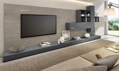 a living room with a large flat screen tv mounted to the side of a wall