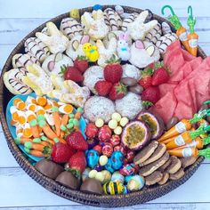 a basket filled with lots of different types of food on top of a white table