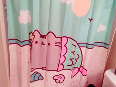 a bathroom with a hello kitty shower curtain