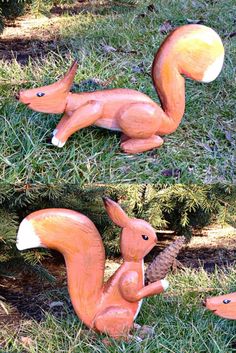 two pictures of an orange squirrel statue in the grass with pine cones on it's feet