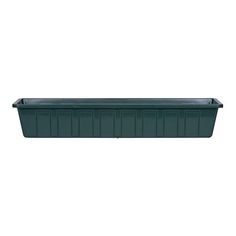 a green plastic planter on a white background