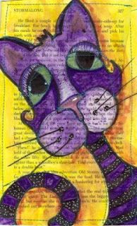 a drawing of a purple cat sitting on top of an open book with words written in it