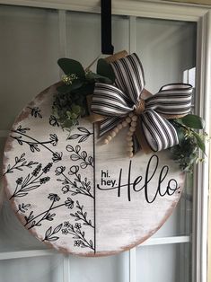 a wooden sign hanging on the side of a door that says hi hey, hello