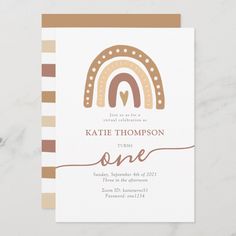 a white and brown card with a rainbow on it