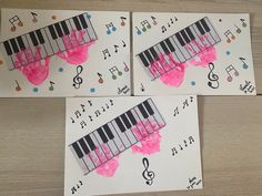 three pieces of paper with music notes and piano keys painted on them, sitting next to each other