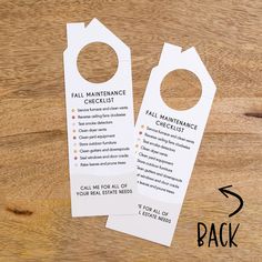 two door hangers with instructions on them sitting on top of a wooden table next to each other