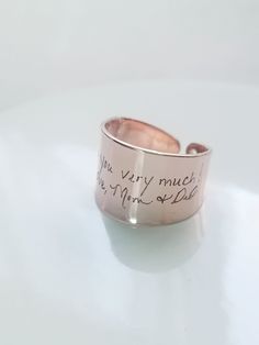 "Actual handwritten ring, custom handwriting ring, engraved signature ring, adjustable name ring\\memorial jewelry, Personalized keepsake gift. Memorial keepsake gift that shows the thought you invested in them. Ring made with Rhodium plated brass and available in 16k gold, silver and rose gold plated. The ring is an open cuff adjustable design, and will best fit US sizes 6.25 through 7.25. Measurement: ** Ring width is about 0.55\" (14 mm). ** Thickness of ring is about 0.04\" ( 1 mm). ❤ Item w Handwriting Ring, Handwritten Ring, Handwritten Jewelry, Signature Ring, Signature Rings, Name Ring, Name Rings, Jewelry Personalized, Personalized Rings