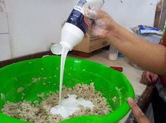 a person pouring milk into a green bowl