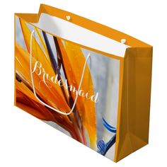 an orange shopping bag with the words you and me on it is shown in front of a white background