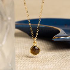 Smokey Quartz Teardrop Pendant Gemstone Gold Necklace - Birthday, Graduation Gift Handmade Jewelry for Women, Bridesmaid, Niece, Graduation Stone: Genuine Smokey Quartz Heart Gemstone: 11mm x 9mm Gold chain: 14k gold filled Chain length: 16-18 inches adjustable Clasp: spring ring Bezel: Vermeil Gold About "Gold Filled Jewelry": Also called rolled-gold. These jewelry items are not actually filled with gold. They are made of a base metal covered by sheets of gold in a mechanical bonding process... Gold Gemstone Necklace, Daughter Graduation, Thick Coat, Cable Chain Necklace, Ring Bezel, Necklace Delicate, Gemstone Necklaces, Heart Gemstone, Minimalist Chic