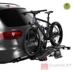 a car with a bike attached to the back of it's trunk in front of a white background