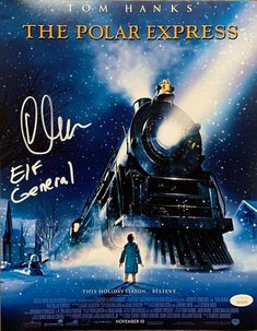 the polar express movie poster with a child standing in front of a train on snow covered ground