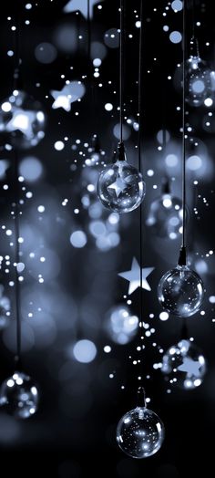 some bubbles hanging from strings with stars in the background