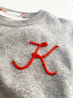 Custom Initial Sweatshirt KIDS Embroidered Initial - Etsy Canada Diy Custom Clothes Ideas, Hand Embroidery Initials, Beaded Embroidery Letters, Hand Embroidered Hat, Embellished Sweatshirt Diy, Embroidered Letters Alphabet, Initial Embroidery Letters, Embroidery Inspiration Jeans, Boy Embroidery Ideas