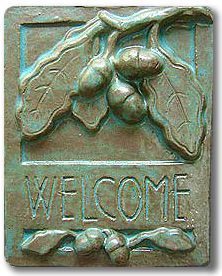 a metal plaque with the words welcome on it