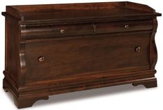 a wooden chest with two drawers on one side