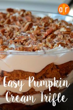 an easy pumpkin cream trifle recipe in a glass dish with pecans on top