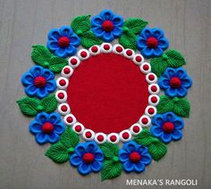 a red, white and blue flowered circle with green leaves on the center is surrounded by smaller blue flowers