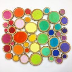 an art project made out of colored wood slices