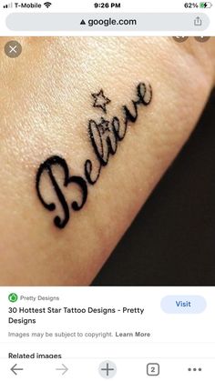 a wrist tattoo with the word believe written on it