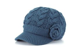 a blue hat with a flower on it