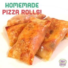 homemade pizza rolls on a white plate with the words homemade pizza rolls