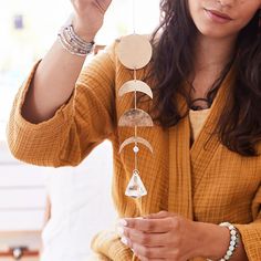 · Suction cup + Metal hook included for window attachment · Dimensions | 14" long x 2" wide · Recommended for indoor use only · Moonstone, known for being the stone of balance Golden Moon, Muslin Bags, Moonstone Stone, Beautiful Rainbow, The Stone, Metal Hooks, Suction Cup, Moon Phases, Daniel Wellington